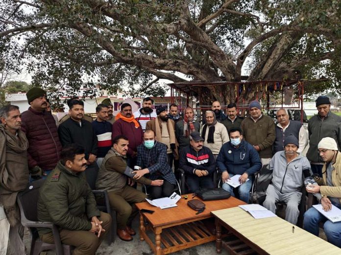 HoD Cardiology GMC & SSH Jammu Dr Sushil Sharma examining patients at Gharota on Sunday.