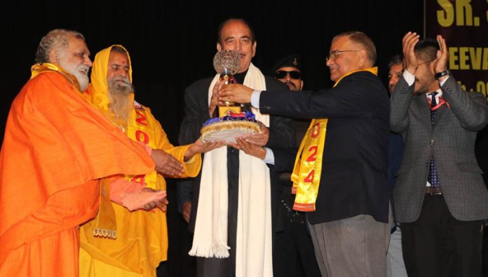 Principal, Rameshwar Mengi presenting a memento to former Chief Minister J&K, Ghulam Nabi Azad on Saturday.