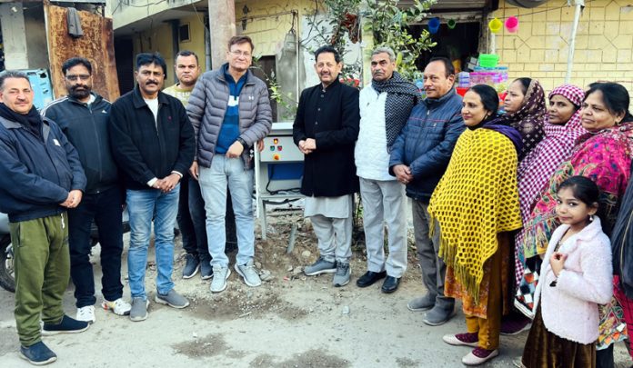 BJP leader, Baldev Singh Billawaria posing for a photograph with others after inaugurating a High Mast Light in Digiana area.