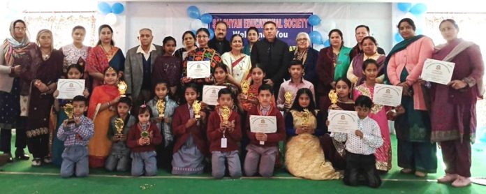 Dignitaries and Sai Shyam Educational Society staff posing with students on Thursday.