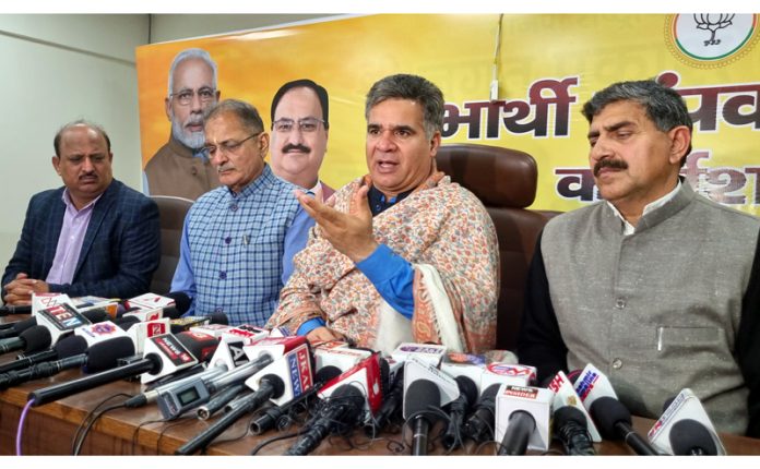 BJP J&K president, Ravinder Raina flanked by MP, Jugal Kishore Sharma, ex Dy CM, Kavinder Gupta and party general secretary, Dr D K Manyal talking to reporters at Jammu on Wednesday.