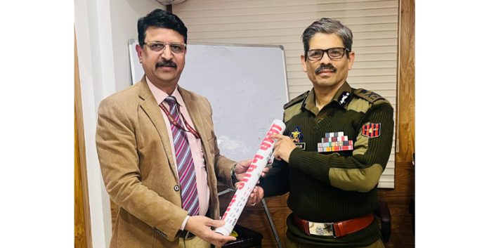 PMG Jammu, Col Vinod Kumar, presenting a PLI calendar to DGP RR Swain at PHQ in Jammu on Monday. PMG Jammu, Col Vinod Kumar, presenting a PLI calendar to DGP RR Swain at PHQ in Jammu on Monday.