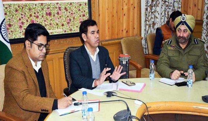 Div Com Kashmir chairing a meeting on Thursday.