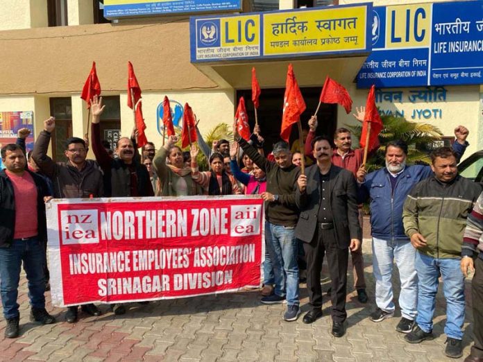 LIC employees raising slogans during a protest at Jammu on Friday. LIC employees raising slogans during a protest at Jammu on Friday.