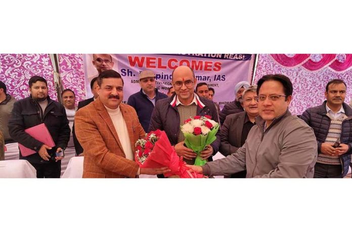 Secretary PWD Bhupinder Kumar being presented bouquet during grievances redressal camp at Reasi on Friday. Secretary PWD Bhupinder Kumar being presented bouquet during grievances redressal camp at Reasi on Friday.