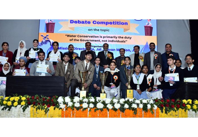 Participants of a debate competition posing for a group photograph.