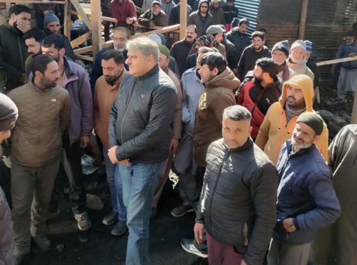 NC leaders during visit at fire hit Banihal vegetable market. NC leaders during visit at fire hit Banihal vegetable market.