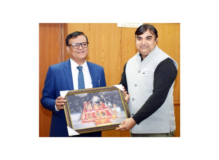 Vice-Chancellor of SMVDU presenting memento to a guest during a programme.