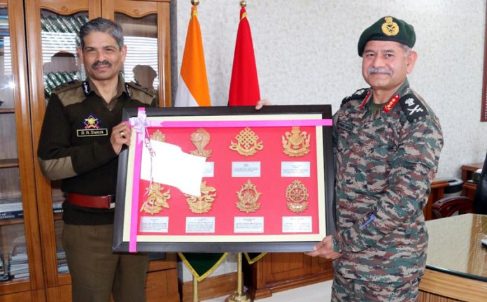 DGP RR Swain presenting Lt Gen Upendra Dwivedi with a souvenir during a farewell function in Jammu on Thursday.