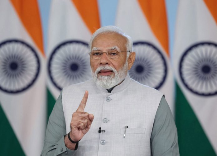 Prime Minister Narendra Modi addressing a programme on the 200th birth anniversary of Swami Dayanand Saraswati via video conferencing at Tankara in Morbi, Gujarat on Sunday. (UNI) Prime Minister Narendra Modi addressing a programme on the 200th birth anniversary of Swami Dayanand Saraswati via video conferencing at Tankara in Morbi, Gujarat on Sunday. (UNI)