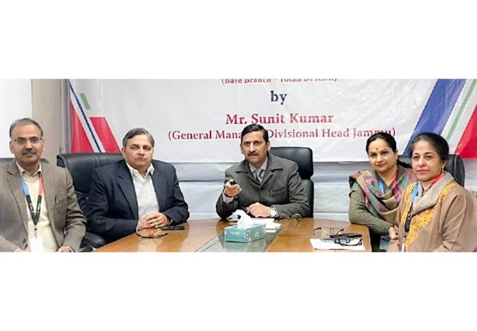 Sunit Kumar, General Manager and Divisional Head of the J&K Bank, e-inaugurating an EBU at Surinsar on Friday.