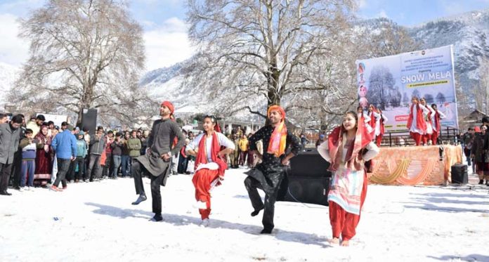 Artists present a dance item during the event 'Snow Mela' in Kishtwar on Monday. Artists present a dance item during the event 'Snow Mela' in Kishtwar on Monday.