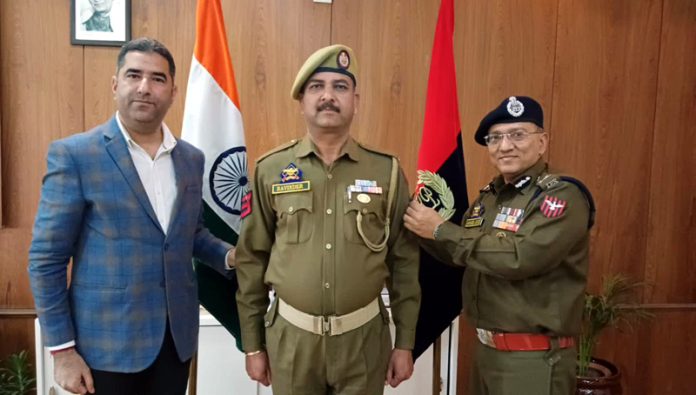ADGP Jammu, Anand Jain, pinning rank to the newly promoted HC at ZPHQ Jammu on Wednesday. ADGP Jammu, Anand Jain, pinning rank to the newly promoted HC at ZPHQ Jammu on Wednesday.