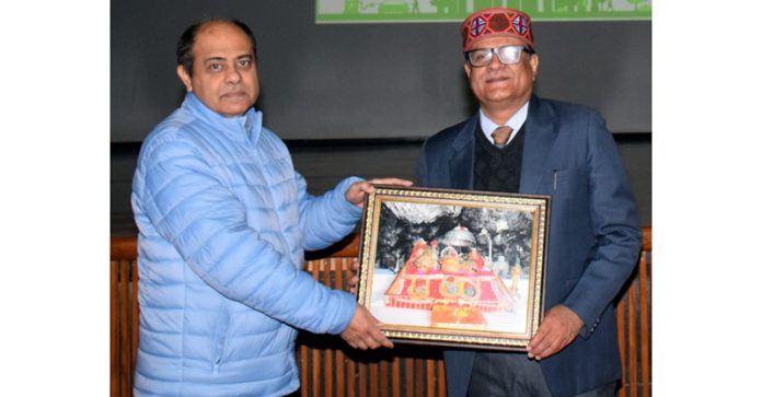 Memento being presented to guest during inaugural of workshop at SMVDU.