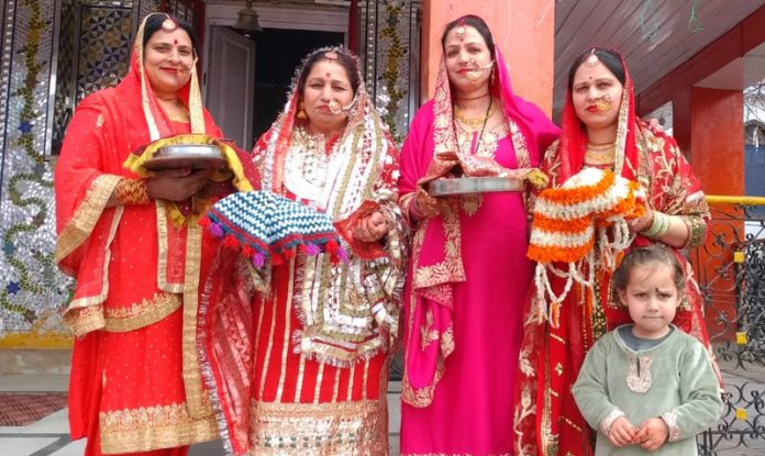 Dressed in bridal outfits, women in Bhaderwah posing for a photograph during ‘Kanchoth’ celebrations. — Excelsior/Tilak Raj