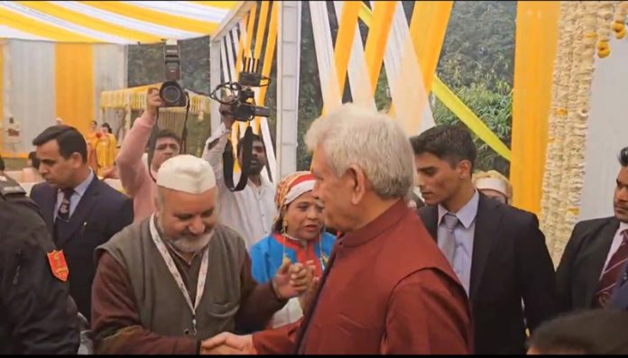 LG Manoj Sinha interacting with Save Sharda Committee Founder, Ravinder Pandita during his visit to Sharda Exhibition at New Delhi on Wednesday.