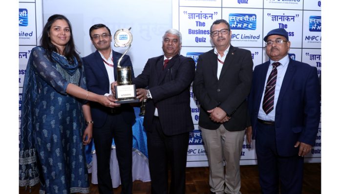R.P. Goyal, Director (Finance), NHPC giving away the prizes to winners of Quiz competition held in Jammu on Tuesday.