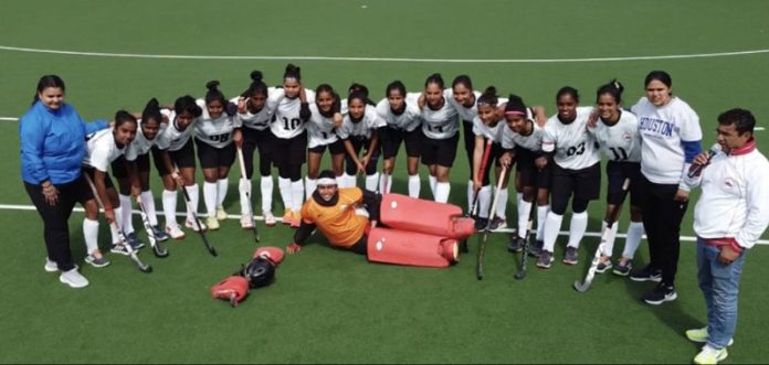 Caption: Players of winning team posing together for a group photograph.