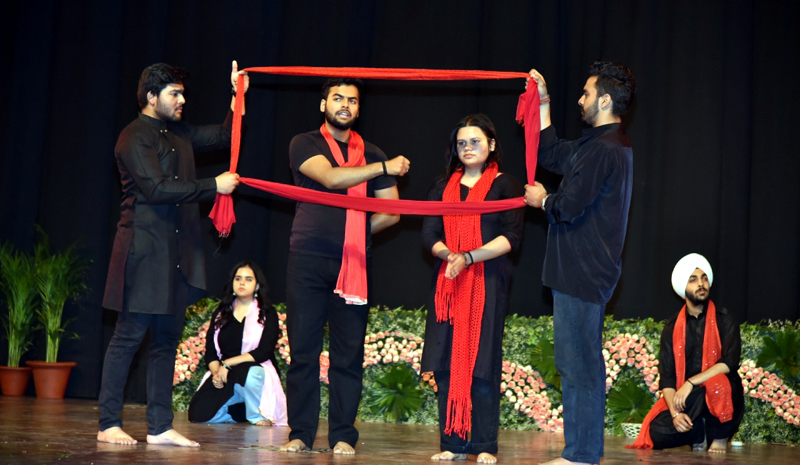 Artists performing on stage during 'Goonj-2024' a multi-genre mega festival hosted by University of Jammu on Tuesday.