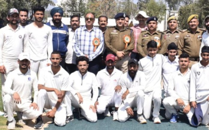 Cricket team posing along with senior police officers at Kathua on Tuesday.