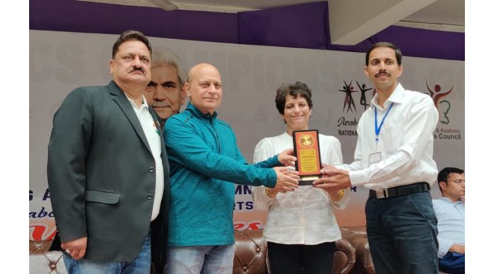 Principal Govt Medical College Jammu Dr Ashutosh Gupta presenting memento during National Aerobic Gymnastics Championship 2023-24 at Jammu on Tuesday. Principal Govt Medical College Jammu Dr Ashutosh Gupta presenting memento during National Aerobic Gymnastics Championship 2023-24 at Jammu on Tuesday.