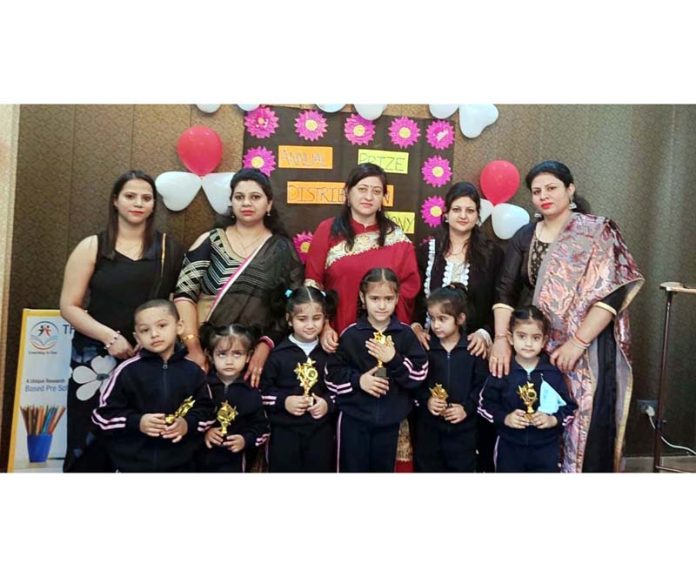 Principal and teachers of American School Paloura posing with academic achievers.