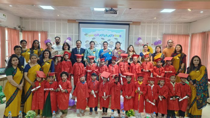 Students posing along with teachers and dignitaries during a programme on Tuesday.