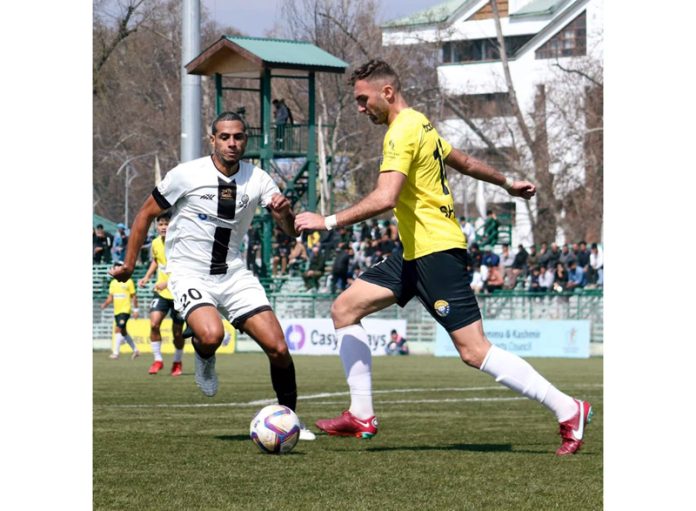 Players in action during a football match at TRC Ground, Srinagar on Saturday. Players in action during a football match at TRC Ground, Srinagar on Saturday.