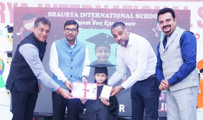 Jammu Municipal Corporation Commissioner Rahul Yadav presenting certificates to a toddler during a school event on Tuesday. Jammu Municipal Corporation Commissioner Rahul Yadav presenting certificates to a toddler during a school event on Tuesday.