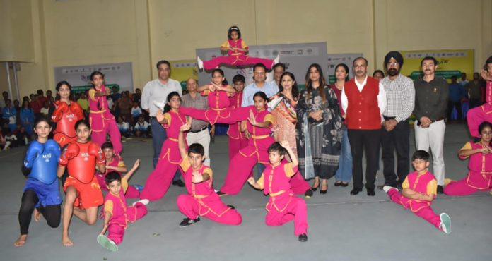 Commissioner Secretary Tourism J&K, Yasha Mudgal posing along with Wushu athletes during the inaugural event of Khelo India Wushu Women's League-2023 at Jammu.