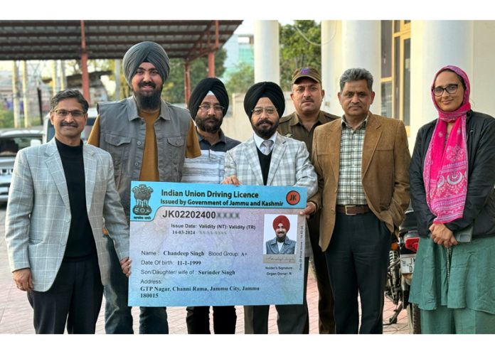 Transport Commissioner J&K Rajinder Singh Tara presenting Driving License to specially abled International player, Chandeep Singh.