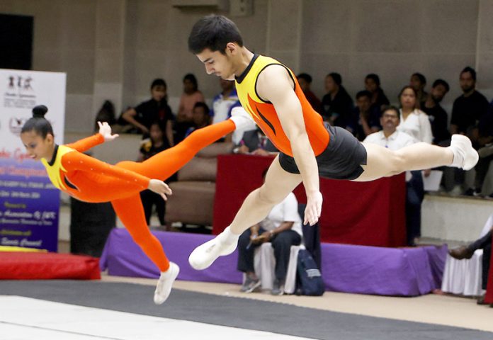 Gymnasts performing during National Aerobic Gymnastics Championship at MA Stadium in Jammu on Sunday. -Excelsior/Rakesh