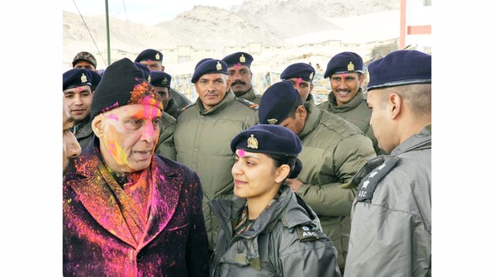 Defence Minister Rajnath Singh during Holi celebrations with soldiers in Leh on Sunday.