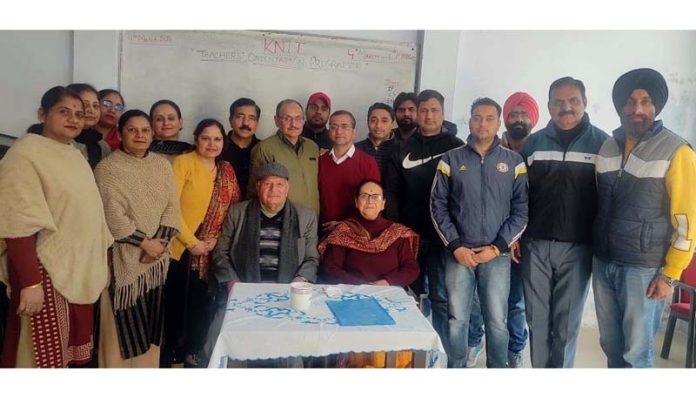School staff posing for group photograph.