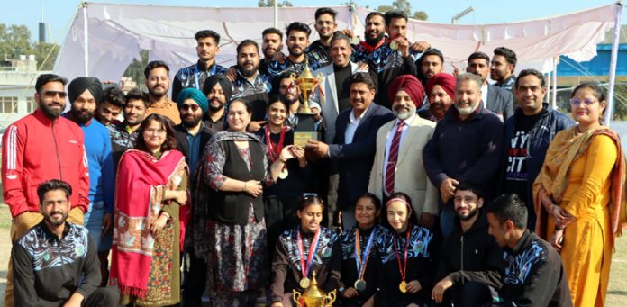 Winning team posing along with trophy during closing ceremony of 46th Annual Inter-Collegiate Athletic Meet (M&W) Championship 2023-24 at Jammu University on Thursday. Winning team posing along with trophy during closing ceremony of 46th Annual Inter-Collegiate Athletic Meet (M&W) Championship 2023-24 at Jammu University on Thursday.