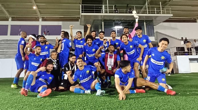 RKFC football team posing for group photograph.