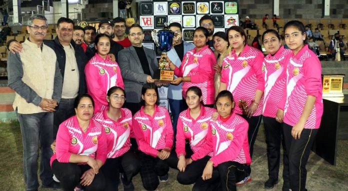 Winning team posing with trophy on Thursday.