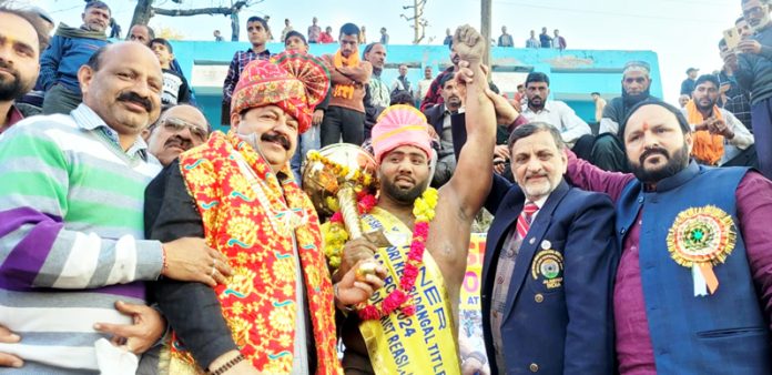 Chief Guest Ajay Nanda posing along with winner of 26th Shiv Khori Kesari Dangal title on Sunday at Reasi.