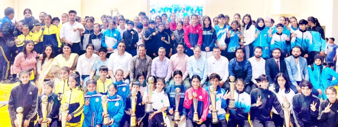 Winning team posing with trophy along with Chief Guest at Jammu University on Sunday. Winning team posing with trophy along with Chief Guest at Jammu University on Sunday.