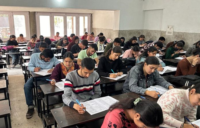 Students busy in taking their exam during a Mega Scholarship Test conducted by SRCC in Jammu on Sunday. Students busy in taking their exam during a Mega Scholarship Test conducted by SRCC in Jammu on Sunday.