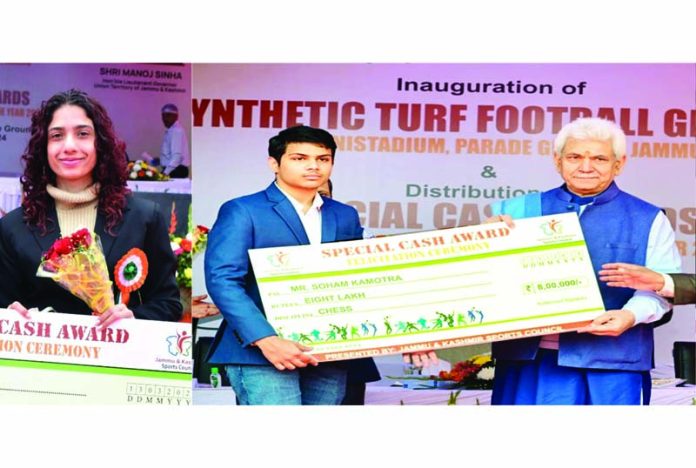 Shreya Gupta receiving cheque of Rs 1 lakh and Sohan Kamotra Rs 8 lakh from LG Manoj Sinha at Parade Ground, Jammu on Wednesday. Shreya Gupta receiving cheque of Rs 1 lakh and Sohan Kamotra Rs 8 lakh from LG Manoj Sinha at Parade Ground, Jammu on Wednesday.