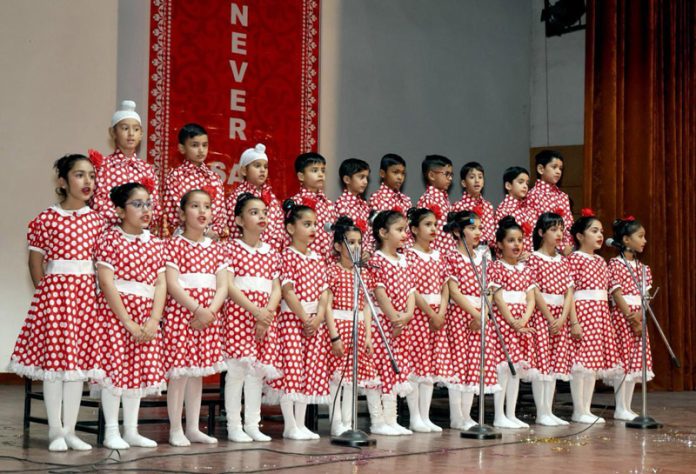 DIS students presenting a group song.