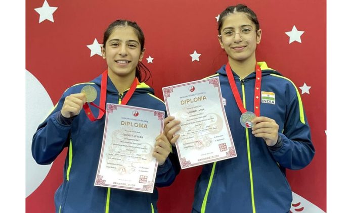 Wushu Sisters, Ansa Chishti and Ayeera Chishti Great posing with medals and certificates. Wushu Sisters, Ansa Chishti and Ayeera Chishti Great posing with medals and certificates.