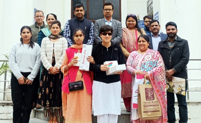 Visually impaired students and others at Govt College for Women Parade posing for group photograph after getting Smart Visual Aids. Visually impaired students and others at Govt College for Women Parade posing for group photograph after getting Smart Visual Aids.