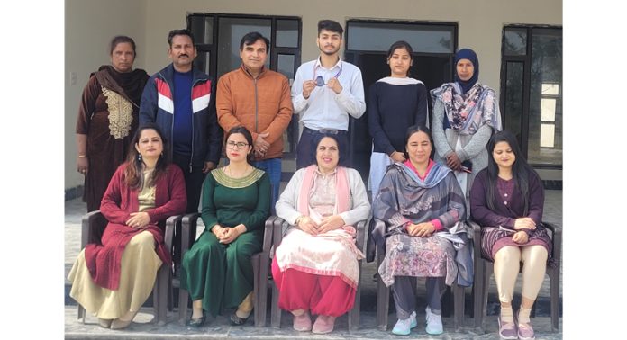 Government Degree College Purmandal student Vikas Sharma posing with College faculty.