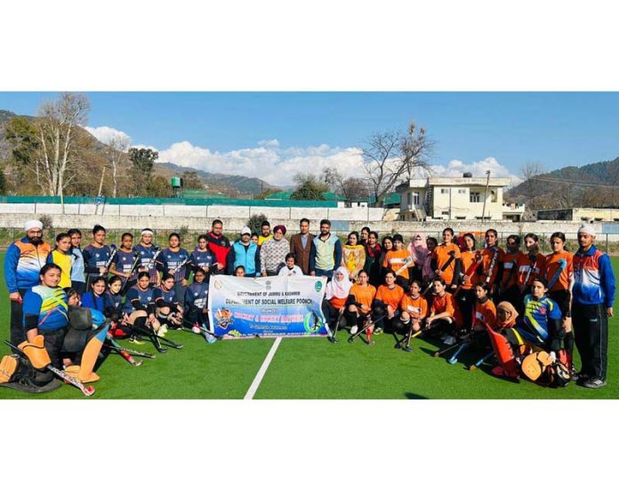 Hockey players posing with dignitaries at Poonch. Hockey players posing with dignitaries at Poonch.