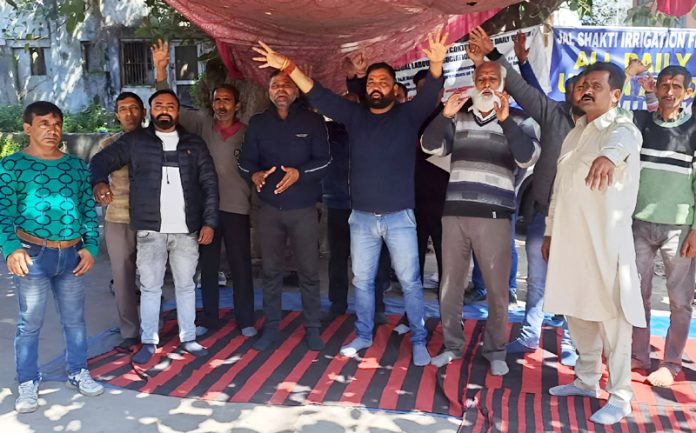 Daily wagers raising slogans during a protest demonstration at Jammu on Saturday.