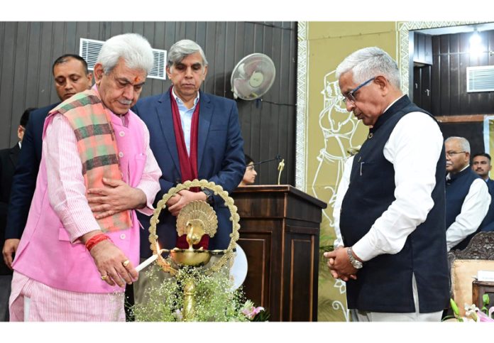 LG Manoj Sinha lighting ceremonial lamp during inauguration of capacity building programme on Tuesday.