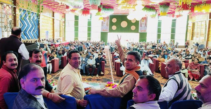 BJP president Ravinder Raina addressing a party meeting at Reasi on Monday.