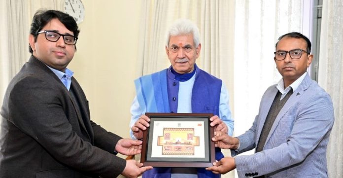 Director Postal Services Prateek Singh presenting a memento to LG Manoj Sinha.